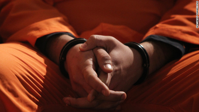 A suspected member of Iraq&#39;s Naqshbandi group sits handcuffed at a press conference following his arrest in Baghdad on January 3, 2012. Iraq&#39;s interior ministry held a security briefing to present the confessions of 21 men accused of being involved in attacks across the country and belonging to the Naqshbandi group backed by Izzat al-Duri, executed dictator Saddam Hussein&#39;s number two who is still on the run. AFP PHOTO/AHMAD AL-RUBAYE (Photo credit should read AHMAD AL-RUBAYE/AFP/Getty Images) 