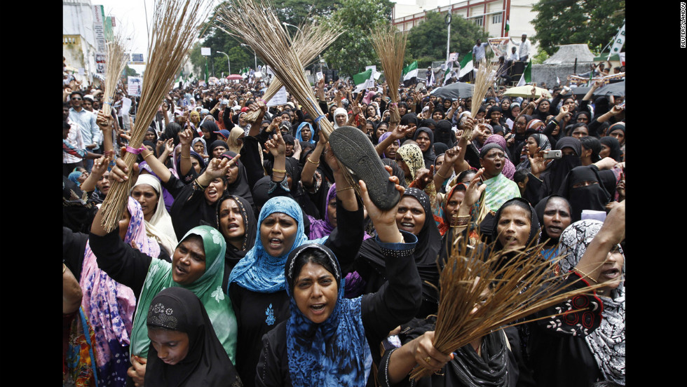 Muslim protesters holding shoes and brooms shout anti-U.S. slogans on Saturday during a protest against the film they consider blasphemous to Islam near the U.S. Consulate-General in Chennai, India.