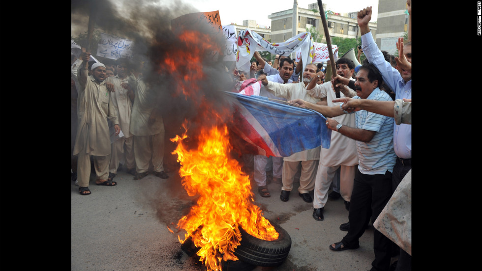 Pakistani Muslims burn a U.S. flag during a protest rally in Islamabad on Saturday. The Pakistani Taliban on Saturday issued a call to young Muslims worldwide and within the country to rise up against an anti-Islam movie. 