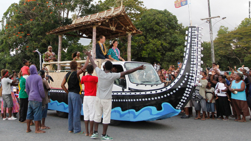 Britain&#39;s Prince William and his wife, Catherine, Duchess of Cambridge, are greeted by Solomon Islanders on Sunday.