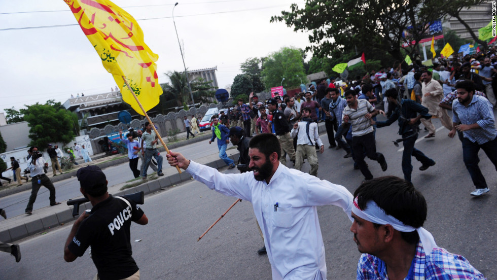 Pakistani protesters march toward the U.S. Consulate in Karachi on Sunday.