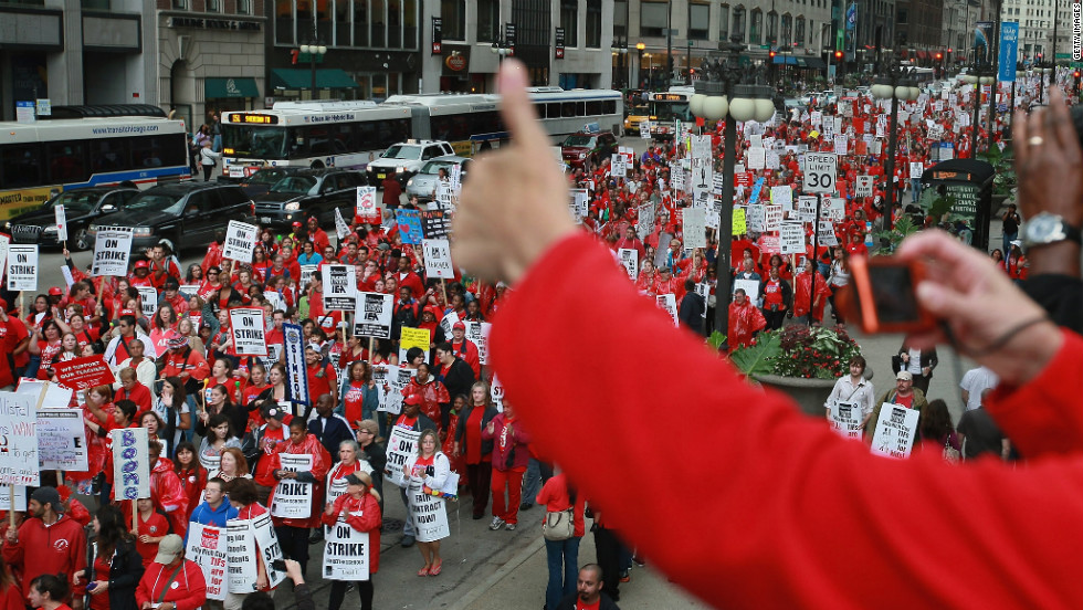 An observer shows her support for the march down Michigan Avenue.