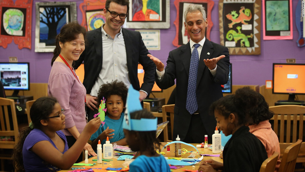 Chicago Mayor Rahm Emanuel, right, visits schoolchildren at Woodson Regional Library on Monday. The library is one of 78 public libraries in the city serving as &quot;safe havens&quot; for students who are not in school because of the strike.