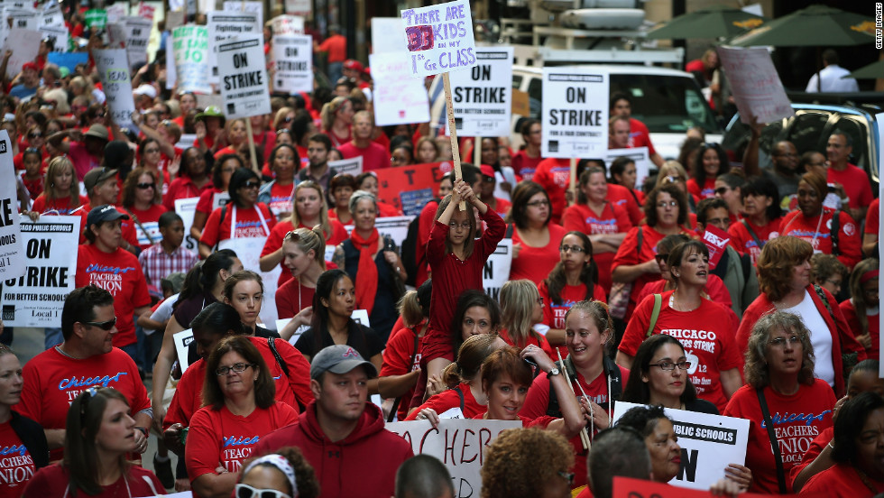 Thousands of teachers and their supporters march in front of the Chicago Public Schools headquarters on Monday. With more than 350,000 students, Chicago is home to the nation&#39;s third-largest school system.