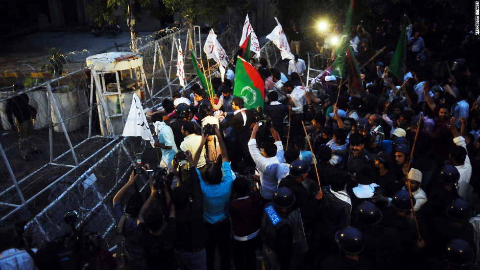 Pakistani Shiite Muslims shout anti-American slogans Monday in Lahore.