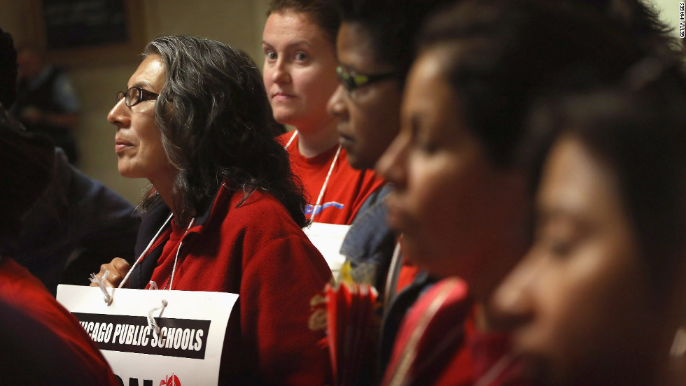 Striking teachers attend a news conference by the Chicago Teachers Solidarity Campaign outside the office of Mayor Rahm Emanuel in Chicago on Monday, September 17. Emanuel sought court action to force teachers back to work.