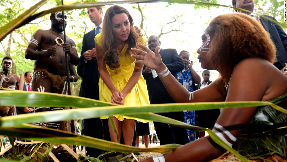 Catherine, Duchess of Cambridge, and Prince William speak with traditional weavers during a visit to a village in the Solomon Islands on Monday, September 17.