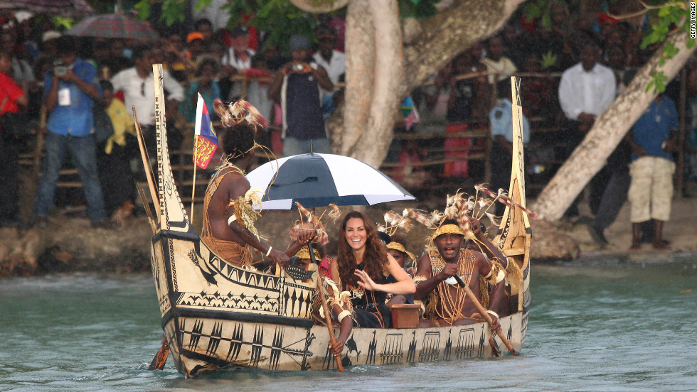 Catherine, Duchess of Cambridge, and Prince William travel in a traditional canoe during a visit to Tuvanipupu Island in the Solomon Islands on Monday.