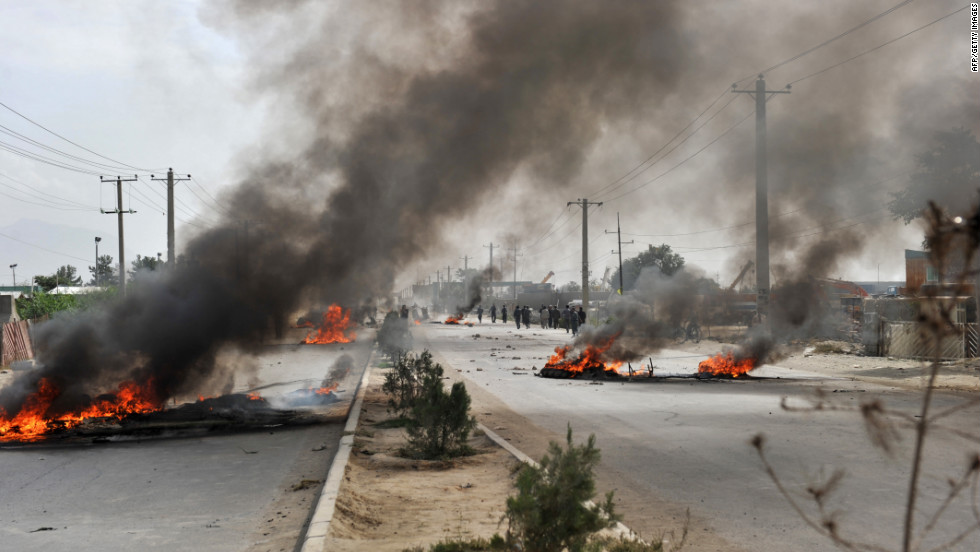 Barricades of tires burn Monday in Kabul. 