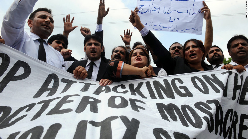 Pakistani lawyers shout anti-American slogans as they march Monday in Lahore.