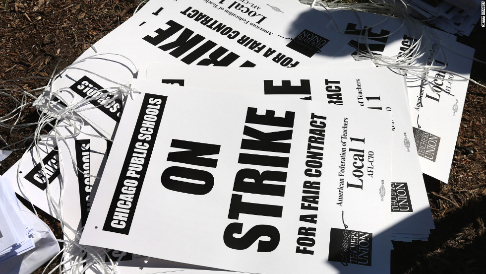 Strike posters are left on the ground in Union Park on Saturday. More than 26,000 teachers and support staff walked off their jobs on September 10 after the union failed to reach an agreement with the city on compensation, benefits and job security.