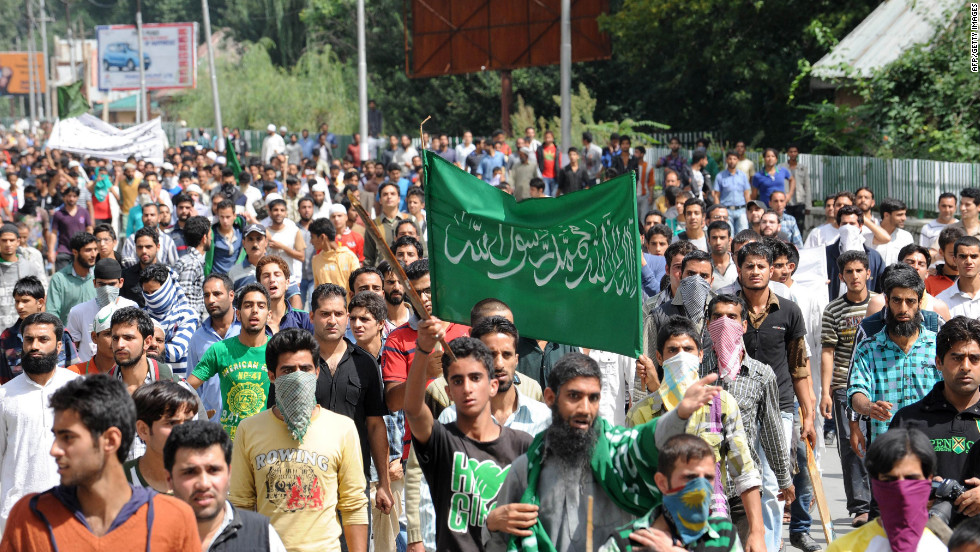 Kashmiri Muslim demonstrators shout anti-U.S. and Israeli slogans before a clash with Indian police  during a protest and one-day strike called by several religious and political organizations in Srinagar on Tuesday.