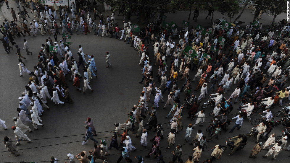 Pakistani Sunni Muslims march during a protest against the anti-Islam movie in Peshawar on Tuesday. Police used tear gas to disperse a crowd of more than 2,000 protesters trying to reach the U.S. Consulate in northwest Pakistan.