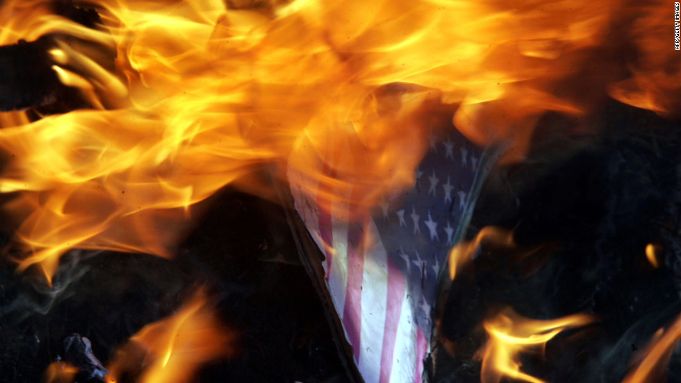 Indian Muslims burn an American flag with a picture of U.S. President Barack Obama as they protest against a U.S.-made anti-Islam film on Tuesday, September 18, near the U.S. Consulate in Chennai. About 5,000 people have gathered in front of the building. Google India has already blocked access to the film, which the government has condemned as &quot;offensive.&quot;