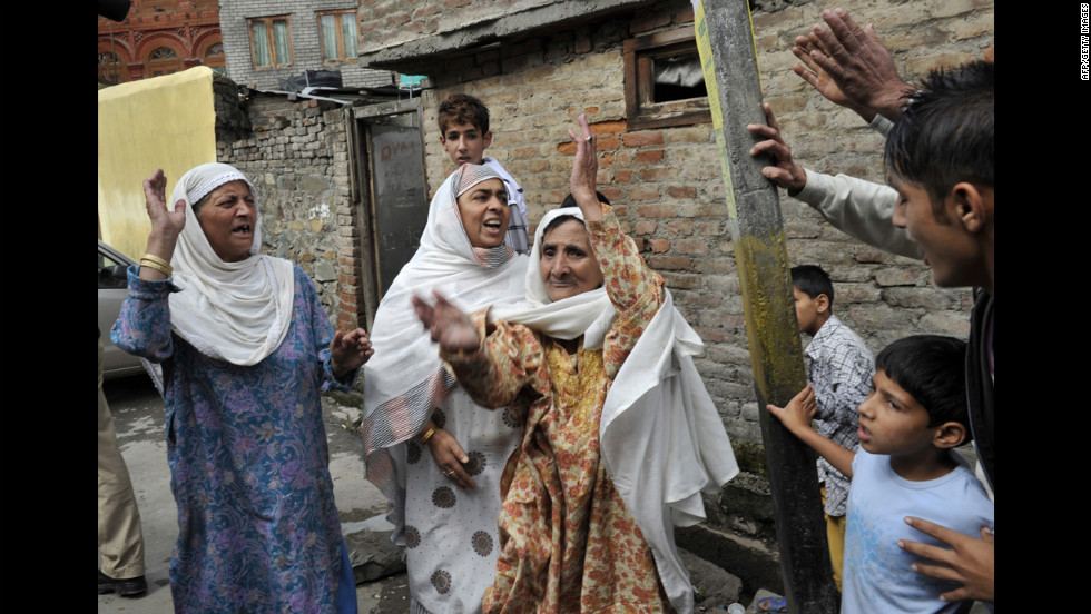 Muslim women shout Islamic slogans in Srinagar on Tuesday.