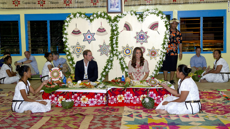 The couple enjoy a traditional dinner at Tausoa Lima Falekaupule on Tuesday in Tuvalu. 