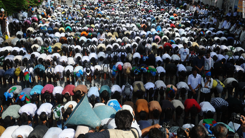 Pakistani activists of the hard line Sunni party Jamaat-e-Islami (JI) offer prayers near the U.S. Consulate on Wednesday in Lahore.