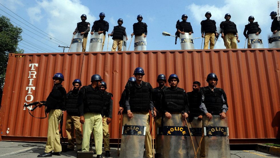 Pakistani police stand guard on a blocked street in front of the U.S. Consulate during a protest in Lahore on Wednesday.