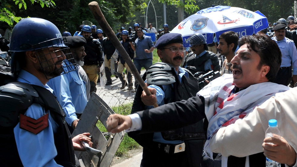 Pakistani riot policemen hold back lawyers shouting anti-U.S. slogans as they attempt to reach the U.S. Embassy  in Islamabad on Wednesday, September 19. More than 30 people have been killed around the world during more than a week of attacks and violent protests linked to a controversial film seen as insulting to the Prophet Mohammed.  