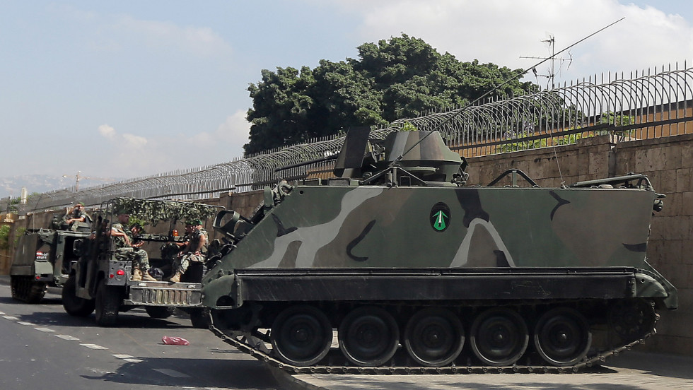 Lebanese army soldiers secure the area around the French ambassador&#39;s residence in Beirut on Wednesday. France has ordered special security measures around its embassies and schools because of fears of a hostile reaction to a magazine&#39;s publication of cartoons of the Prophet Mohammed, the foreign ministry said. 