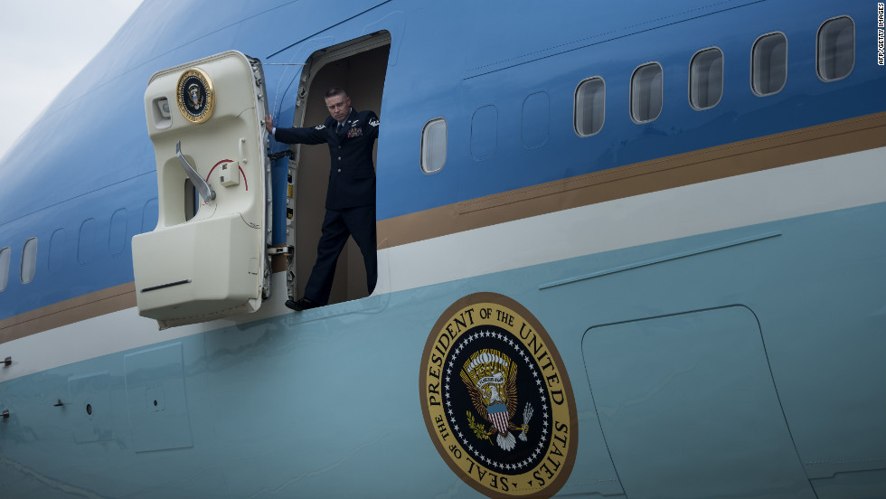 A crew member opens the door to Air Force One after the jet arrived at John F. Kennedy Airport in New York on Tuesday.