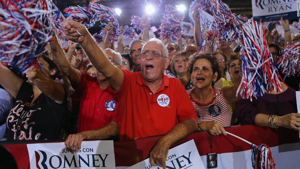 Supporters cheer as they listen to Romney speak during a Juntos Con Romney Rally at the Darwin Fuchs Pavilion on Wednesday, September 19, in Miami.