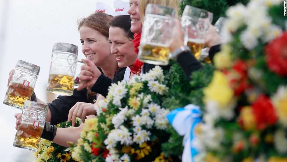 Waitresses of the Spaten brewery wave with beer mugs. &lt;a href=&quot;http://www.cnn.com/SPECIALS/world/photography/index.html&quot; target=&quot;_blank&quot;&gt;See more of CNN&#39;s best photography&lt;/a&gt;.
