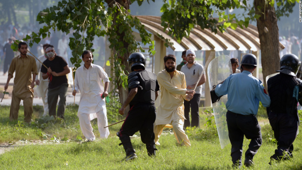 Pakistani Muslim demonstrators clash with police Friday during a protest near the U.S. consulate in Islamabad.