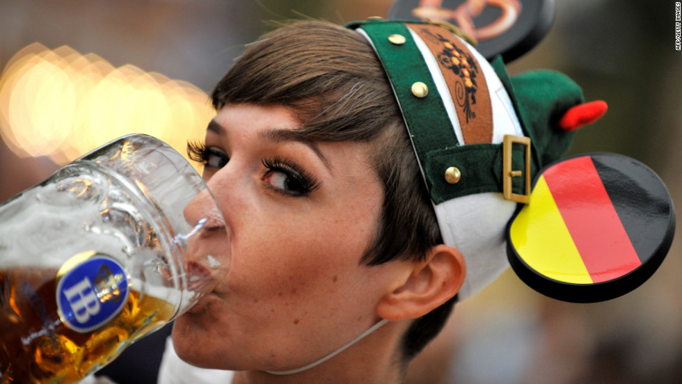 A young woman drinks beer at the Oktoberfest beer festival on Monday, September 24. 