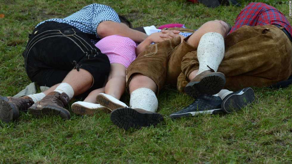 Visitors rest on the grass on Sunday.