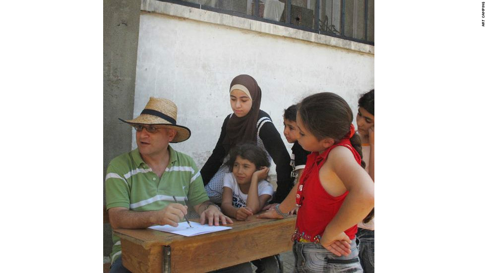 Touma leads a workshop with refugee children in Aleppo in August as part of the Art Camping project.