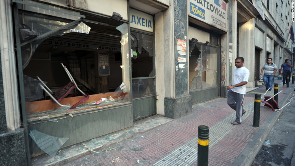 Protesters smashed the windows of a store during a demonstration in central Athens.