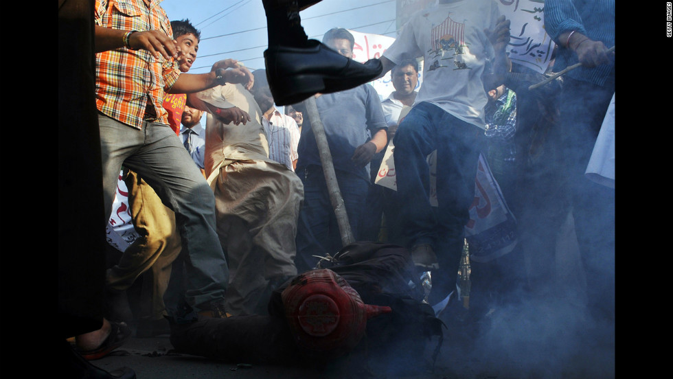 Pakistani demonstrators beat an effigy of Florida pastor Terry Jones during a protest against an anti-Islam film in Lahore on Monday, September 24. More than 50 people have died around the world in violence linked to protests against the low-budget movie, which mocks Islam and the Prophet Mohammed, since the first demonstrations erupted on September 11. &lt;a href=&quot;http://www.cnn.com/SPECIALS/world/photography/index.html&quot;&gt;See more of CNN&#39;s best photography&lt;/a&gt;.