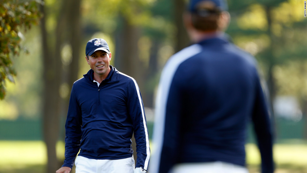 Matt Kuchar chats with U.S. teammate Webb Simpson on the practice ground on Thursday.