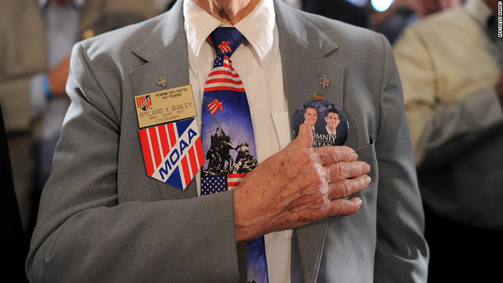 Veterans at the American Legion Post 176 pray before Romney speaks Thursday in Springfield.