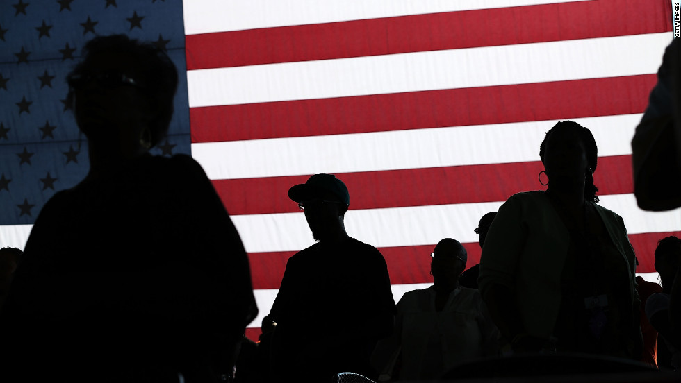 People listen to Obama speak at the Farm Bureau Live arena in Virginia Beach on Thursday.