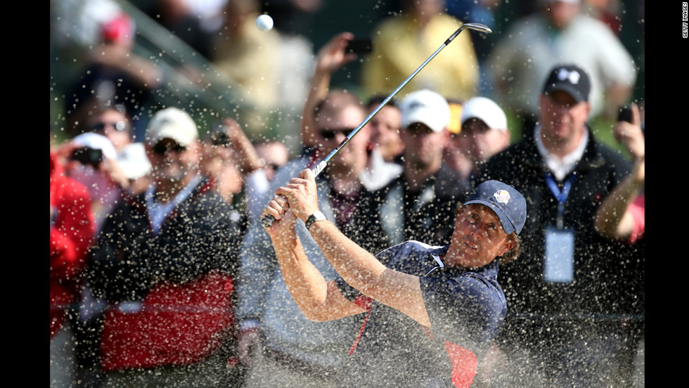 Phil Mickelson of the United States plays a bunker shot during the fourth and final preview day of the 39th Ryder Cup at Medinah Country Club on Thursday, September 27.
