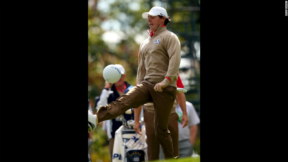 Rory McIlroy of Europe kicks a PGA ball in between play of the practice round Thursday.