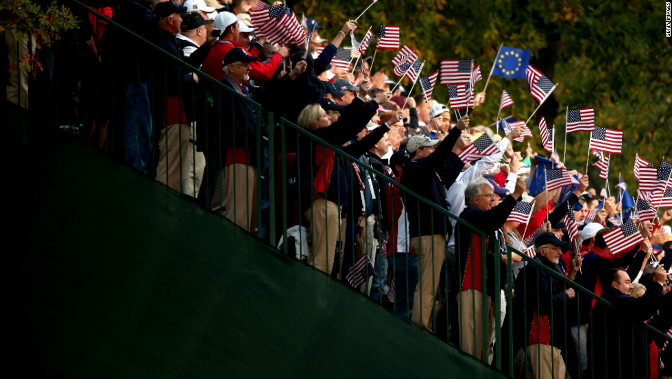 USA fans cheer the players on the first tee Friday.