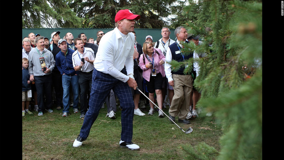 Steve Stricker of the United States hits a shot from the rough on the first hole.