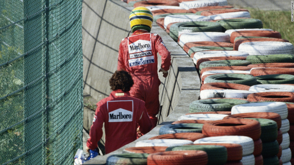 Stand off: Senna and Prost walk away after the early crash at Suzuka in the final race of the 1990 season which left the Brazilian as world champion.