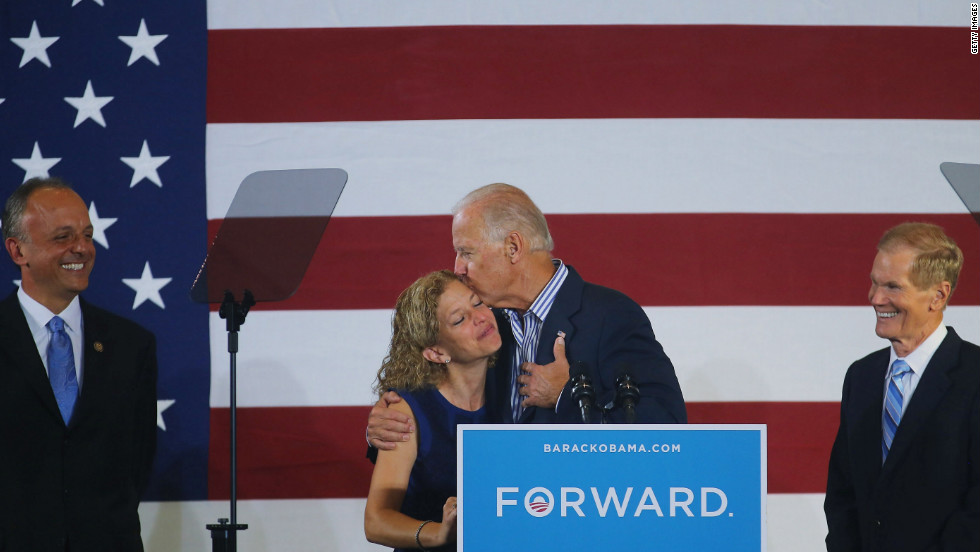 Vice President Joe Biden hugs U.S. Rep. Debbie Wasserman Schultz, chairwoman of the Democratic National Committee, as he arrives for a campaign event Friday in Boca Raton, Florida.