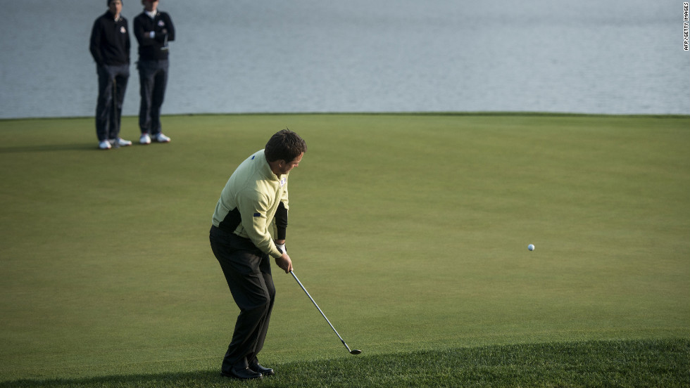 Team Europe&#39;s Graeme McDowell chips onto the second hole&#39;s green Friday.