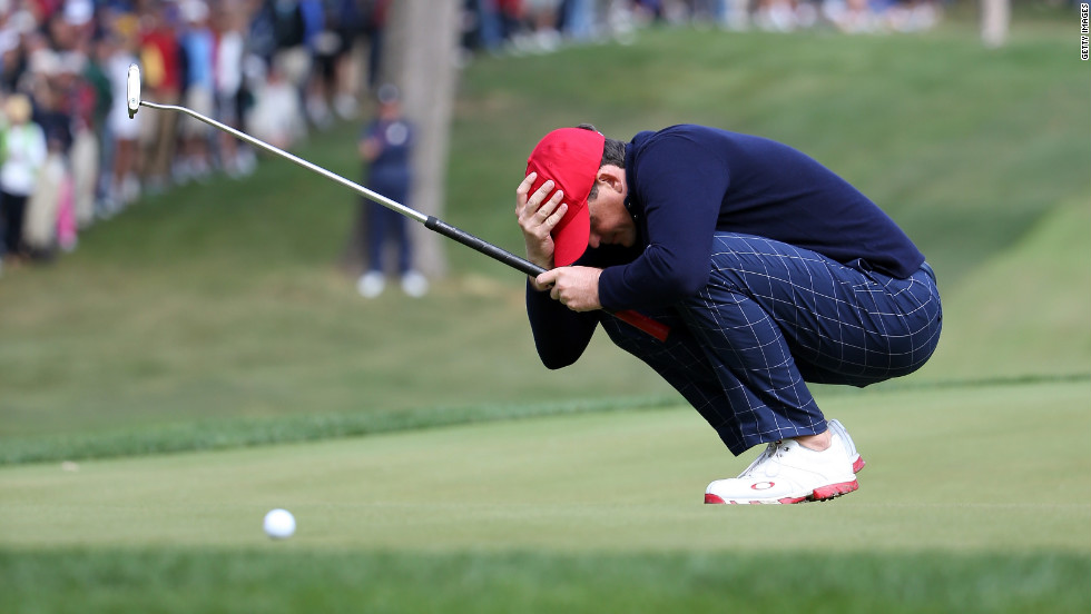 Keegan Bradley of the United States reacts after putting on the 14th green Friday.