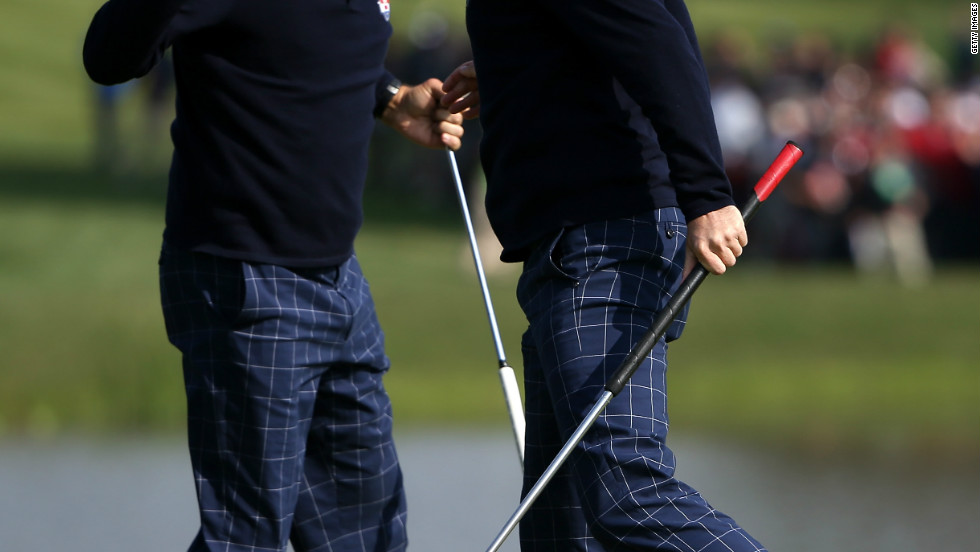 Phil Mickelson and Keegan Bradley celebrate on the 15th green after defeating Luke Donald and Sergio Garcia during the morning foursome matches on Friday.