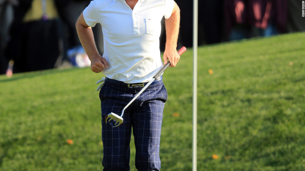 Keegan Bradley of the USA urges a putt to drop on the 15th green during the afternoon four-ball matches.