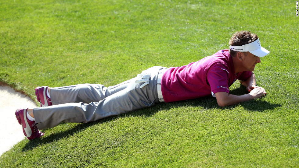 Ian Poulter of Europe lines up a putt on the 16th green on Saturday.