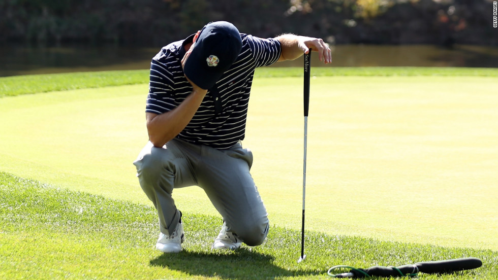 Zach Johnson of American team reacts to a putt on the 12th hole on Saturday.