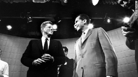 Candidates John F. Kennedy, left, and Richard Nixon exchange smiles ahead of their first TV debate.