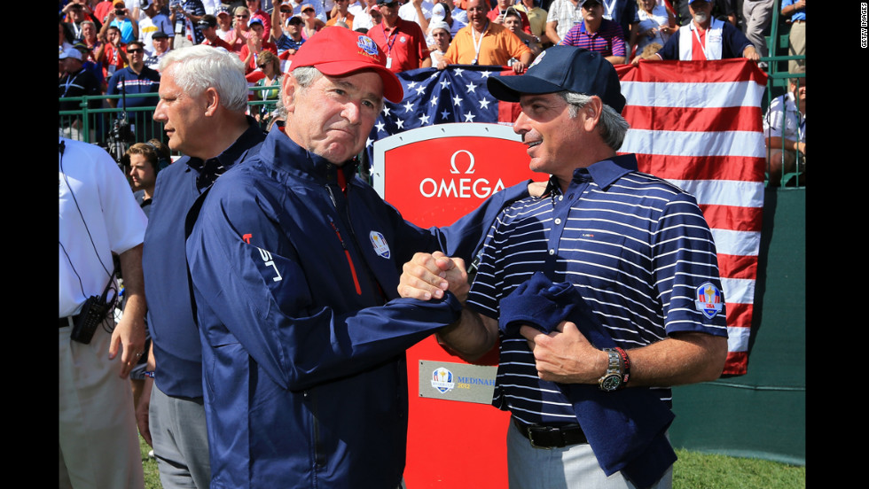Former U.S. President George W. Bush shakes hands with Fred Couples, assistant captain of Team USA on Saturday, September 29.